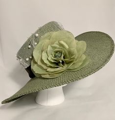 Green garden party fashion hat.  - Hand blocked and shaped toyo straw material - Trimmed with a green flower and sheer overlay, green grosgrain band Fits head sizes 21 - 23 inches Luxury Green Hat Band For Kentucky Derby, Luxury Green Brimmed Top Hat, Luxury Green Brimmed Hat, Green Garden Party, Adjustable Green Novelty Hat, Vintage Green Adjustable Hat, Garden Hat, Gardening Hat, Sheer Overlay