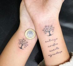 two people with matching wrist tattoos holding their hands together, one has a coin in the other's hand