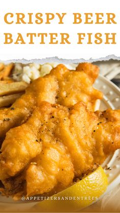 crispy beer battered fish on a white plate with lemon wedges