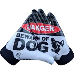 a pair of black and white gloves with the words danger beware of dog on it