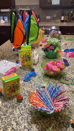 the table is covered with candy and other items