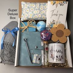 an open box with some items in it and a thank you note on the inside