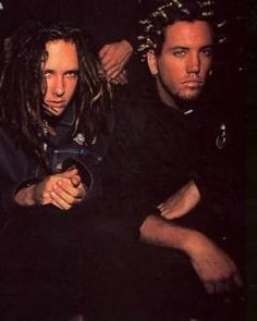 three men sitting next to each other with dreadlocks on