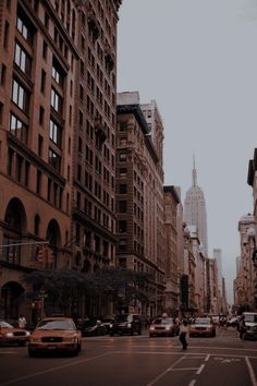 a city street filled with lots of tall buildings