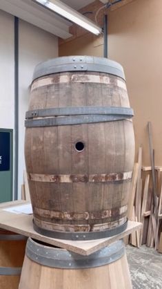 a wooden barrel sitting on top of a table