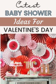 baby shower ideas for valentine's day with pink and red paper fans on the wall