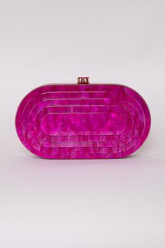 Prepare to inject a burst of color and excitement into your ensemble with the captivating Deco Clutch! Whether you're painting the town red for a night out or gracing a glamorous event, this clutch effortlessly infuses a hint of vintage charm into any attire. Acrylic 8.25" x 4.25" Hinged Closure Removeable Gold Chain Colors may vary with different viewing devices. Chic Purple Evening Clutch, Trendy Red Party Clutch, Chic Pink Party Clutch, Trendy Red Clutch For Parties, Trendy Pink Clutch For Events, Vintage Pink Clutch For Formal Occasions, Chic Burgundy Clutch For Party, Rectangular Burgundy Clutch For Party, Purple Clutch