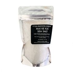 the sea salt is in a bag on a white surface with a black label that says mak ke kit