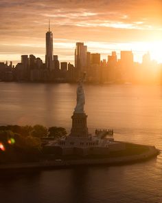 the statue of liberty in new york city at sunset