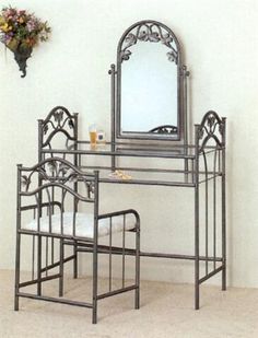 a table with chairs and a mirror on it