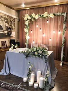 a table with candles and flowers on it