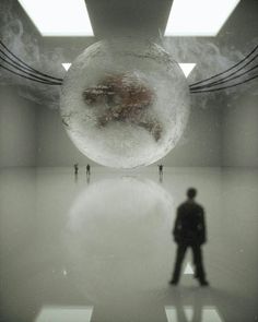 a man standing in front of a large white object