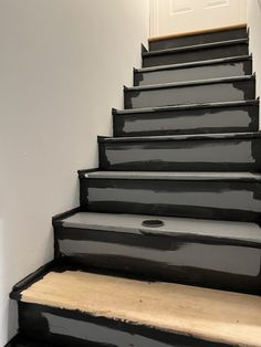 black painted stairs leading up to the door