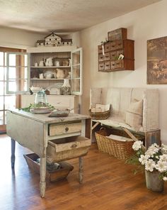 a living room filled with furniture next to a wooden floor covered in lots of white flowers