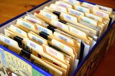 an open file cabinet filled with files and folders