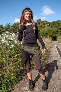 "Are you looking for a roomy, sturdy waist bag for all your festival bits and pieces? This is a hardwearing pixie pocket belt made of thick cotton canvas and decorated with zebra print. It fastens with a double layer of brass popper buttons and a slide buckle that adjusts to your size. It has six pockets in total. The largest one with the lace panel is 6 x 6\" (16 x 16 cm) and does up with a sturdy brass zip and a flap with a popper button. Inside that part is another smaller pocket section to k Bohemian Adjustable Belt For Festivals, Bohemian Brown Belt For Festival, Bohemian Silver Adjustable Belt, Black Post-apocalyptic Style Festival Bottoms, Pixie Pocket Belt, Pocket Belt, Bits And Pieces, Lace Panelled, Suspender Belt