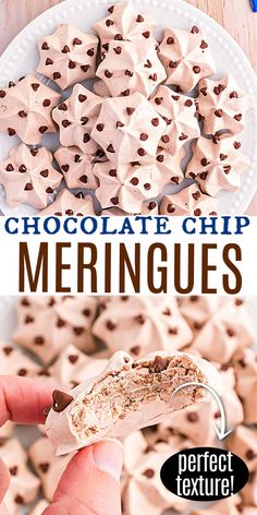 a person holding up a piece of chocolate chip meringues on a white plate