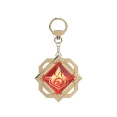 a red and gold keychain with a fire symbol on it's side