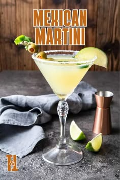 the mexican martini is garnished with lime and an orange slice