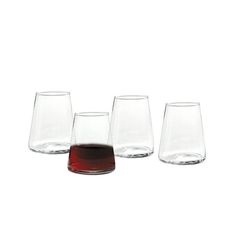 four glasses with different colored liquids in them