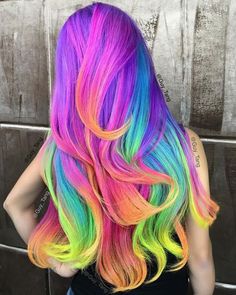 the back of a woman's head with multicolored hair