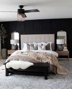 a bedroom with black walls and white carpet