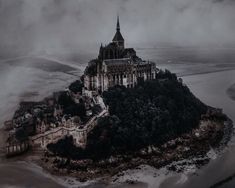 an aerial view of a castle on top of a hill in the middle of nowhere