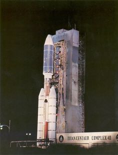 an old photo of a saturn rocket on display