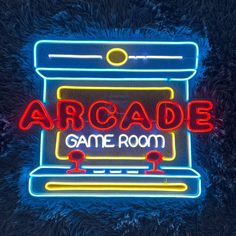 a neon sign that reads arcade game room