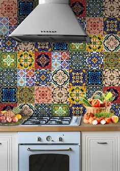 a stove top oven sitting inside of a kitchen next to a wall covered in colorful tiles