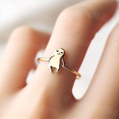 *Free engravings up to 20 characters* Embrace the leisurely grace of this minimalist sloth ring! 🌟 It's a delightful adornment for your finger or a perfect gift for anyone who admires the relaxed and contemplative nature of sloths. 🦥💕 This ring, ideal for stacking or wearing on its own, captures the calm and endearing essence of sloths. Expertly crafted, it features a minimalist sloth design along a delicate band, bringing a touch of nature's serenity to your style. Whether you're a lover of wildlife or seeking a unique piece of jewelry, this sloth ring is a charming and thoughtful choice, ready to accompany you on every laid-back journey.  band width: 1.5mm Feel free to message us for customization! We can usually make minor alterations at no added charge. Covered by full warranty for Sloth Ring, Sloth Gift, Sloth, Statement Rings, Dreaming Of You, Bring It On, Display Homes, Music Clothes, Design