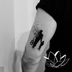 a man with a tattoo on his arm