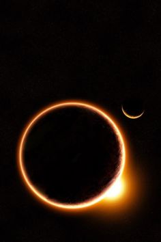 two eclipses are seen in the dark sky, with one bright orange ring visible