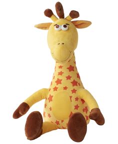 a giraffe stuffed animal sitting on top of a white surface with stars all over it's body