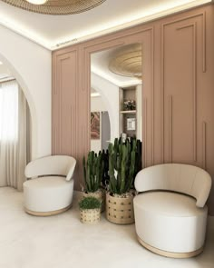 a living room filled with lots of white furniture and large potted cacti