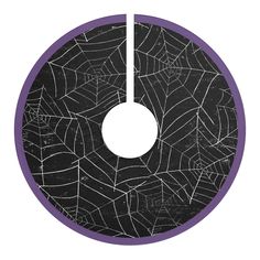 a black and purple circle with spider webs on it