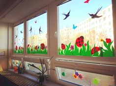 three windows with birds and flowers painted on them