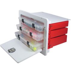 a red and white storage unit with drawers on it's sides, filled with plastic containers