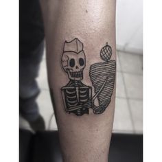 a man with a skeleton tattoo on his leg