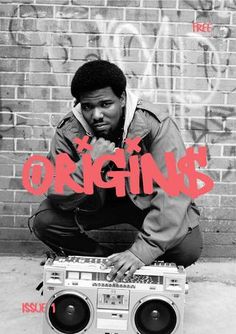 a man squatting down next to a boombox with the words origins on it