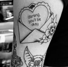 a woman's arm with tattoos on it that says, daring you'll be okay