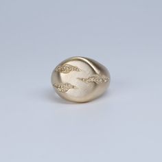 The signet is designed to appear as if it has been carved from stone. Simple but by no means plain, this unusual gold ring is a must-have for all true fans of Jeremy Hoye jewellery. Handmade Gold Necklace, Mens Gemstone Rings, Eternity Ring Gold, Platinum Earrings, Mens Gold Rings, Bold Rings, Mens Bracelet Silver