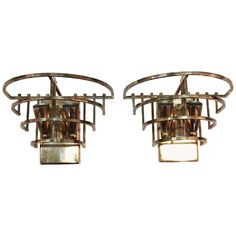 a pair of art deco style ceiling lights