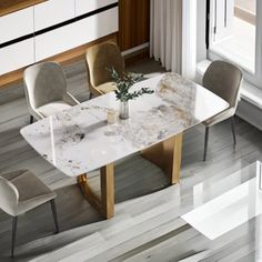 a marble dining table with four chairs around it