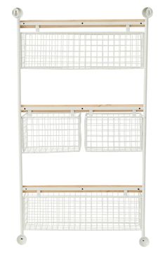 three white shelves with baskets on them and one shelf is holding two bins, the other