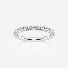 a white gold wedding ring with three rows of diamonds on the top and bottom half