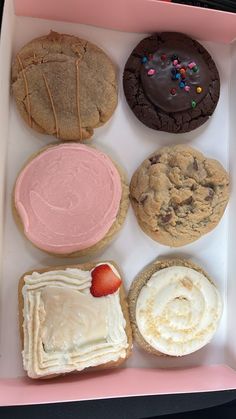 a box filled with different types of cookies