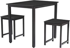 the table and two stools are set up for dining or living room use, black