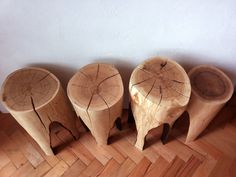 three wooden stools sitting on top of a hard wood floor