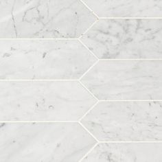 white marble tile with hexagonal pattern in the center and diagonals on each side